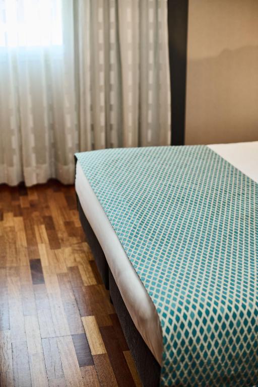 Postel nebo postele na pokoji v ubytování Hotel Da Vinci