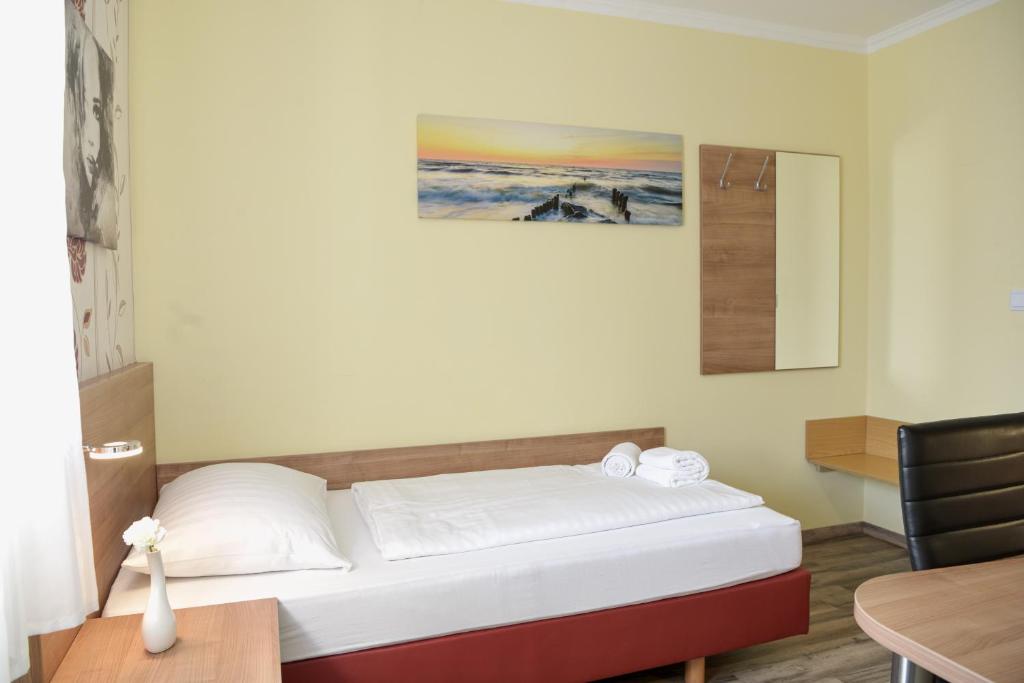 Postel nebo postele na pokoji v ubytování Hotel Heisede