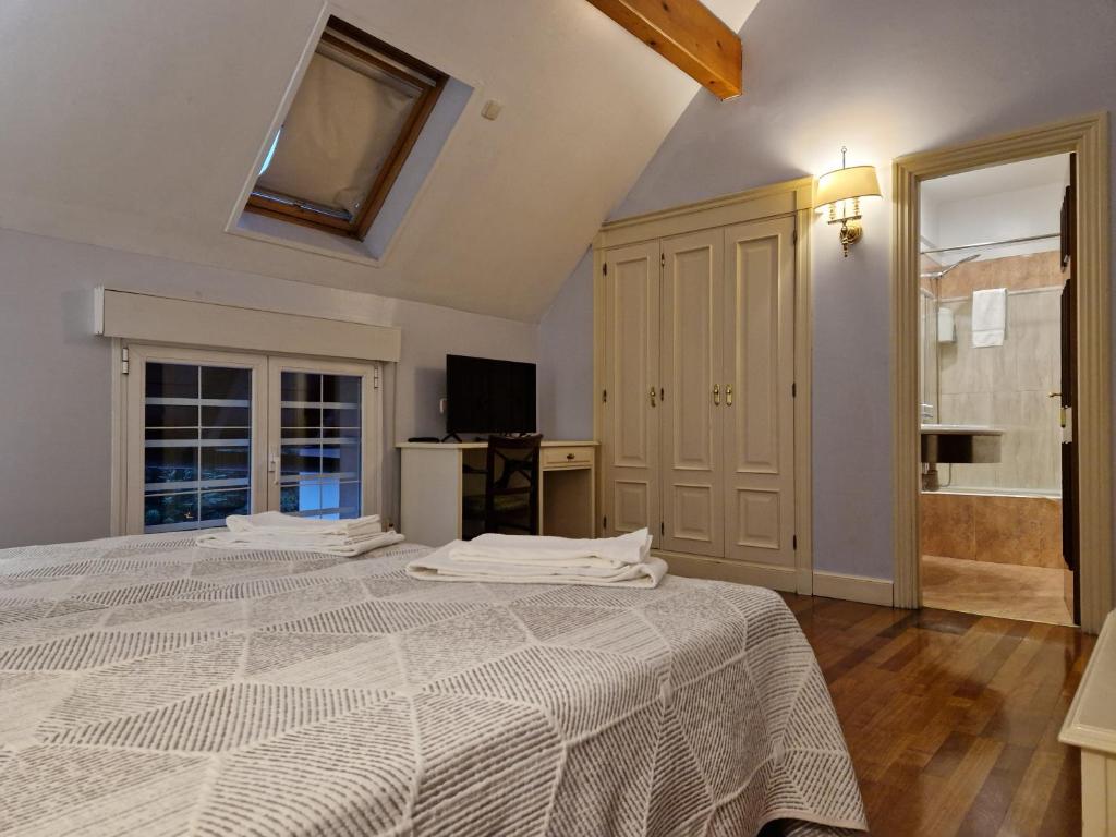 Postel nebo postele na pokoji v ubytování Hotel Harrison Etxea