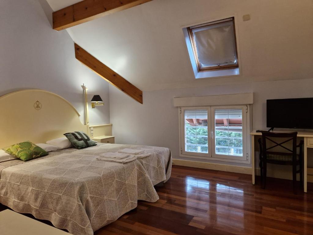 Postel nebo postele na pokoji v ubytování Hotel Harrison Etxea