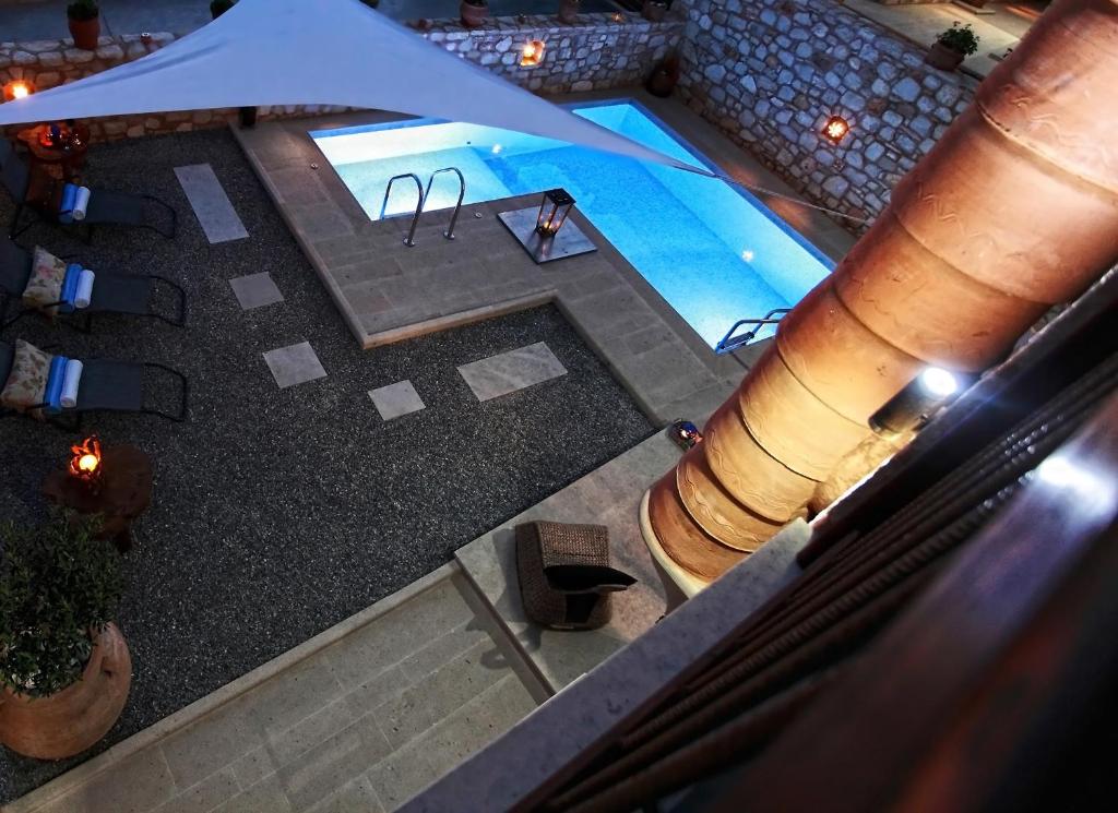 an overhead view of a swimming pool in a building at LaCasa 1 Deluxe Villa with Pool and Jacuzzi in Roumelí