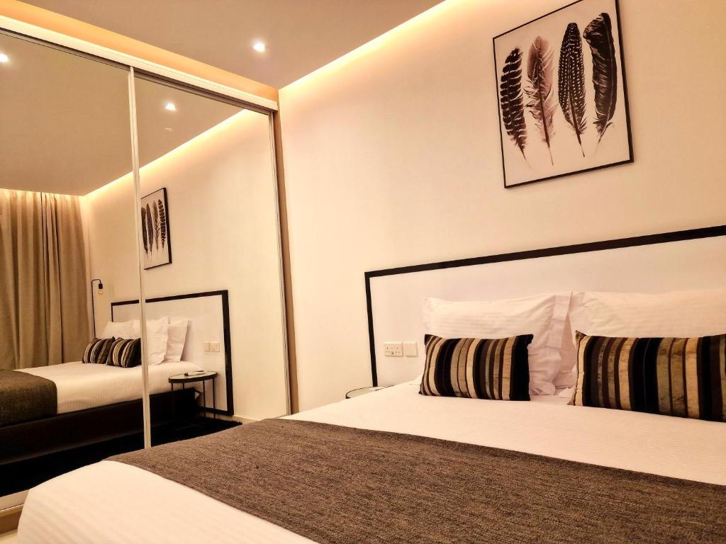 Postel nebo postele na pokoji v ubytování Sveltos Residence Suites