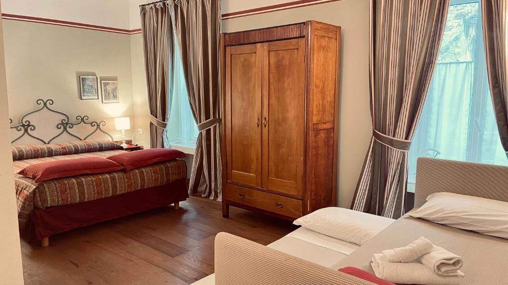 Postel nebo postele na pokoji v ubytování Residenza Le 6 A