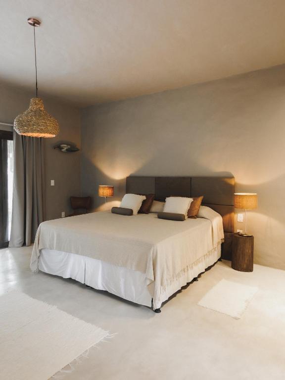 Postel nebo postele na pokoji v ubytování CASA SUKHA Hotel