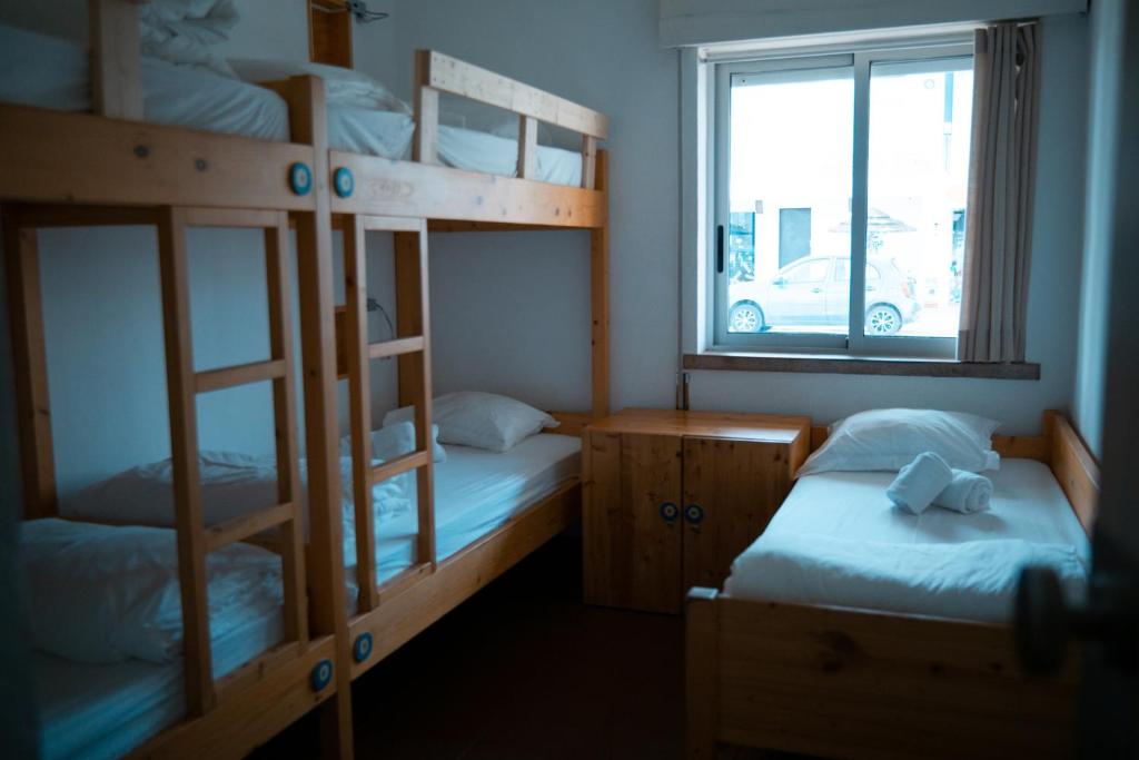 Postel nebo postele na pokoji v ubytování Wax Hostel