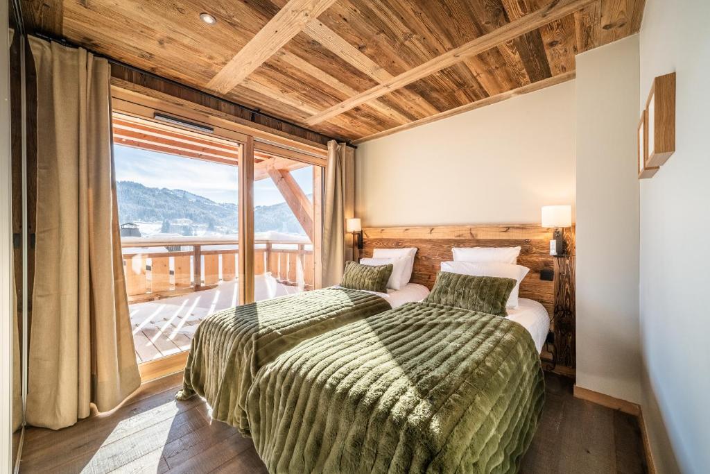Posteľ alebo postele v izbe v ubytovaní Chalet Floquet de Neu Les Gets- BY EMERALD STAY