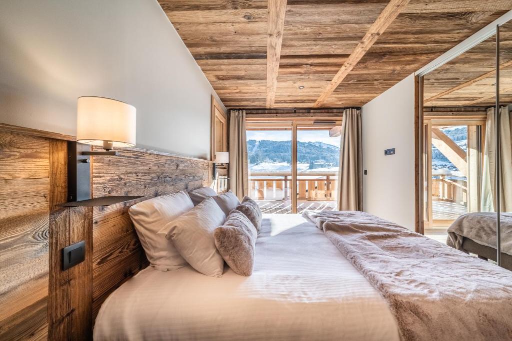 Posteľ alebo postele v izbe v ubytovaní Chalet Floquet de Neu Les Gets- BY EMERALD STAY