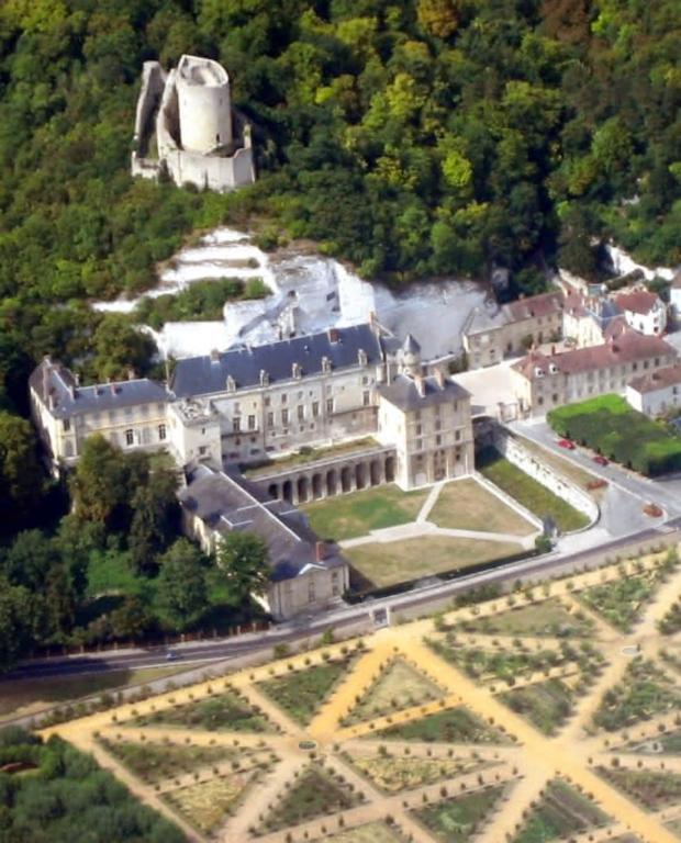 an aerial view of a large building on a hill at Appt cosy coeur historique+park, 5mn gare Vernon in Vernon