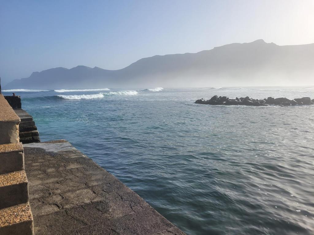 a view of the ocean from a pier at ISLOTE in Famara