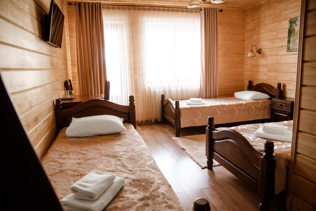 Postel nebo postele na pokoji v ubytování Continental SPA Resort