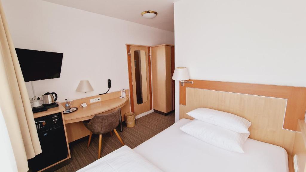 Postel nebo postele na pokoji v ubytování Hotel Garni Superior