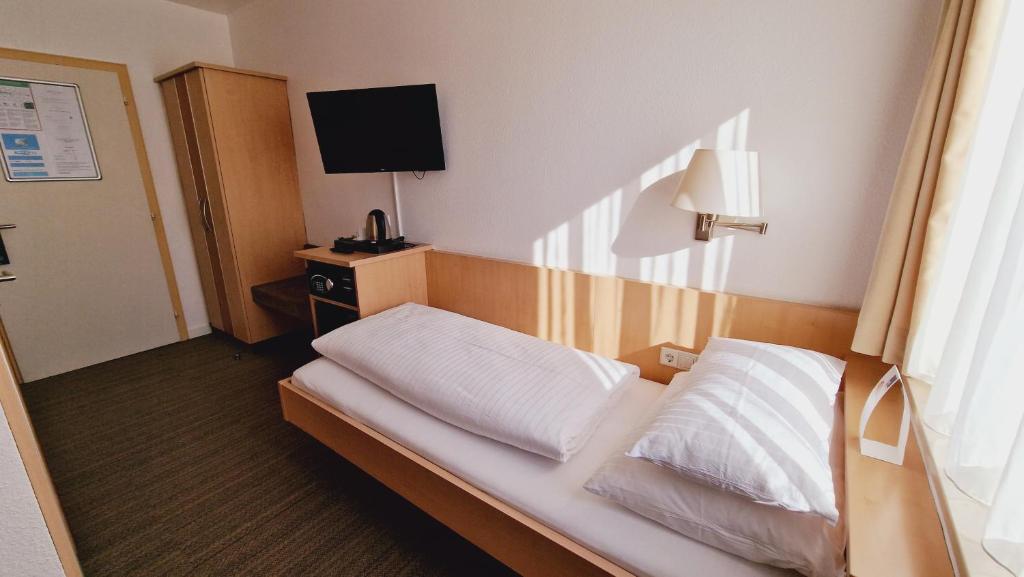 Postel nebo postele na pokoji v ubytování Hotel Garni Superior