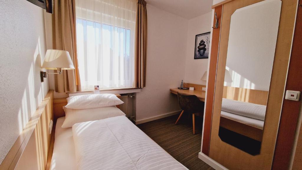 Postel nebo postele na pokoji v ubytování Hotel Garni Superior