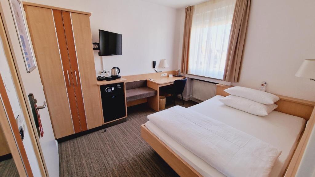 Postel nebo postele na pokoji v ubytování Hotel Garni Superior