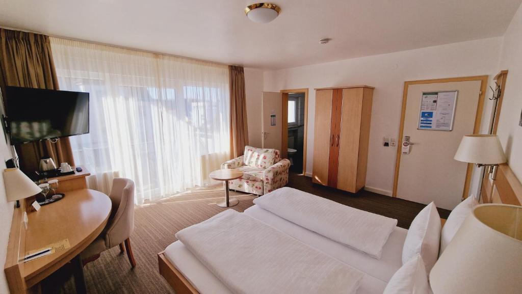 TV a/nebo společenská místnost v ubytování Hotel Garni Superior