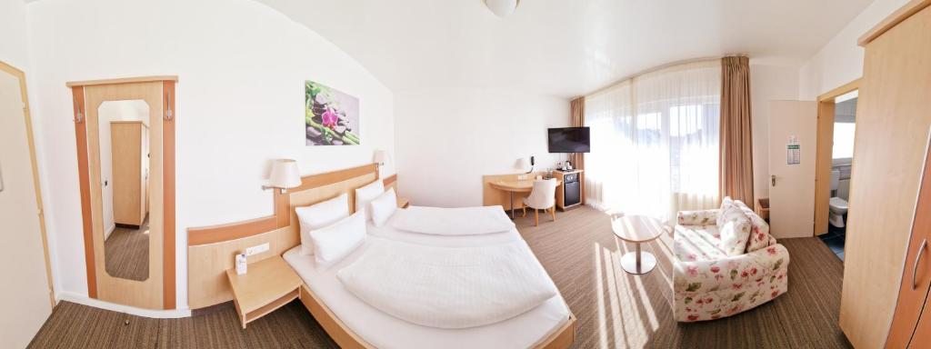 Postel nebo postele na pokoji v ubytování Hotel Garni Superior