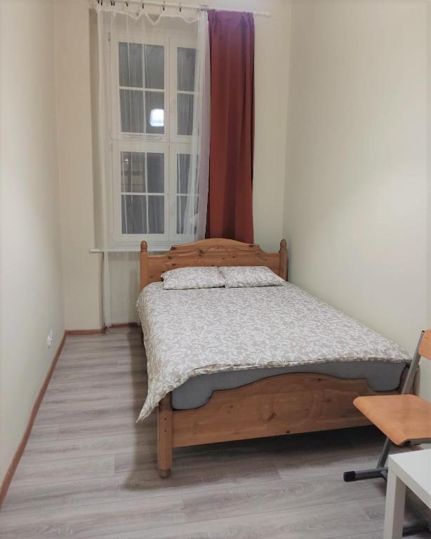 Postel nebo postele na pokoji v ubytování Rynek 7