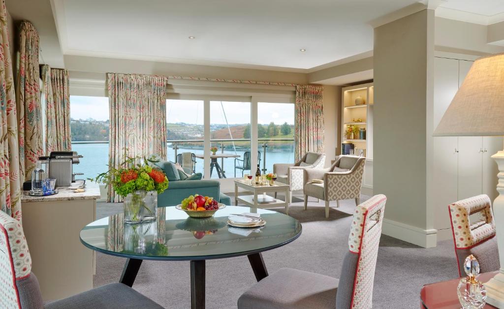 a living room with a view of the water at Trident Hotel Kinsale in Kinsale