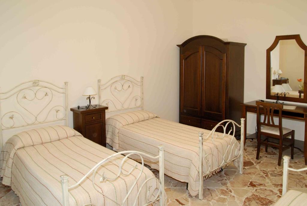 Posteľ alebo postele v izbe v ubytovaní Le Giare B&B