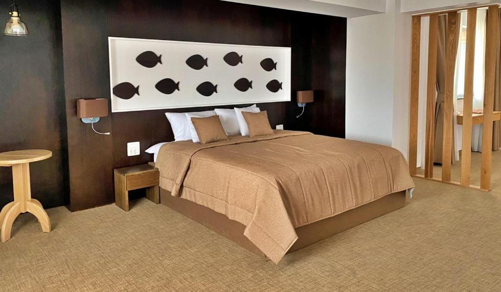 Postel nebo postele na pokoji v ubytování Hotel Condor Tulcea