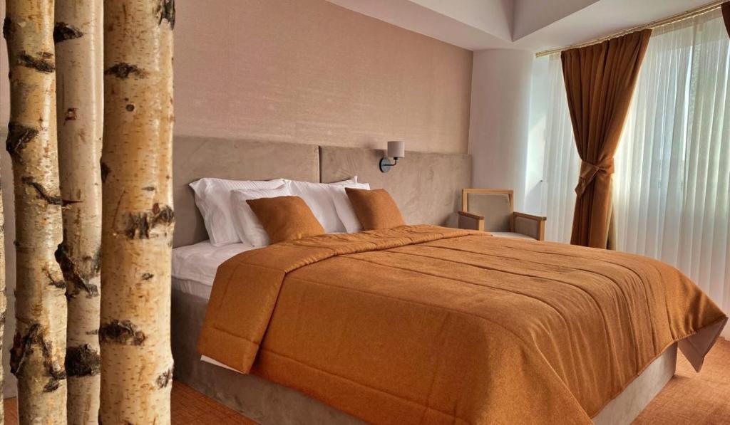 Postel nebo postele na pokoji v ubytování Hotel Condor Tulcea