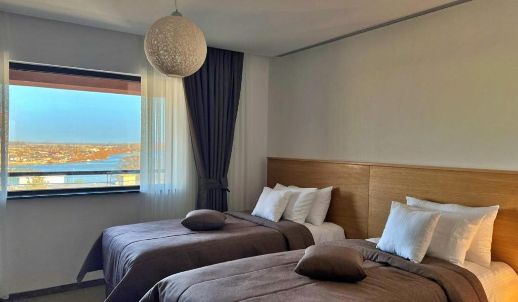 Postel nebo postele na pokoji v ubytování Hotel Condor Tulcea