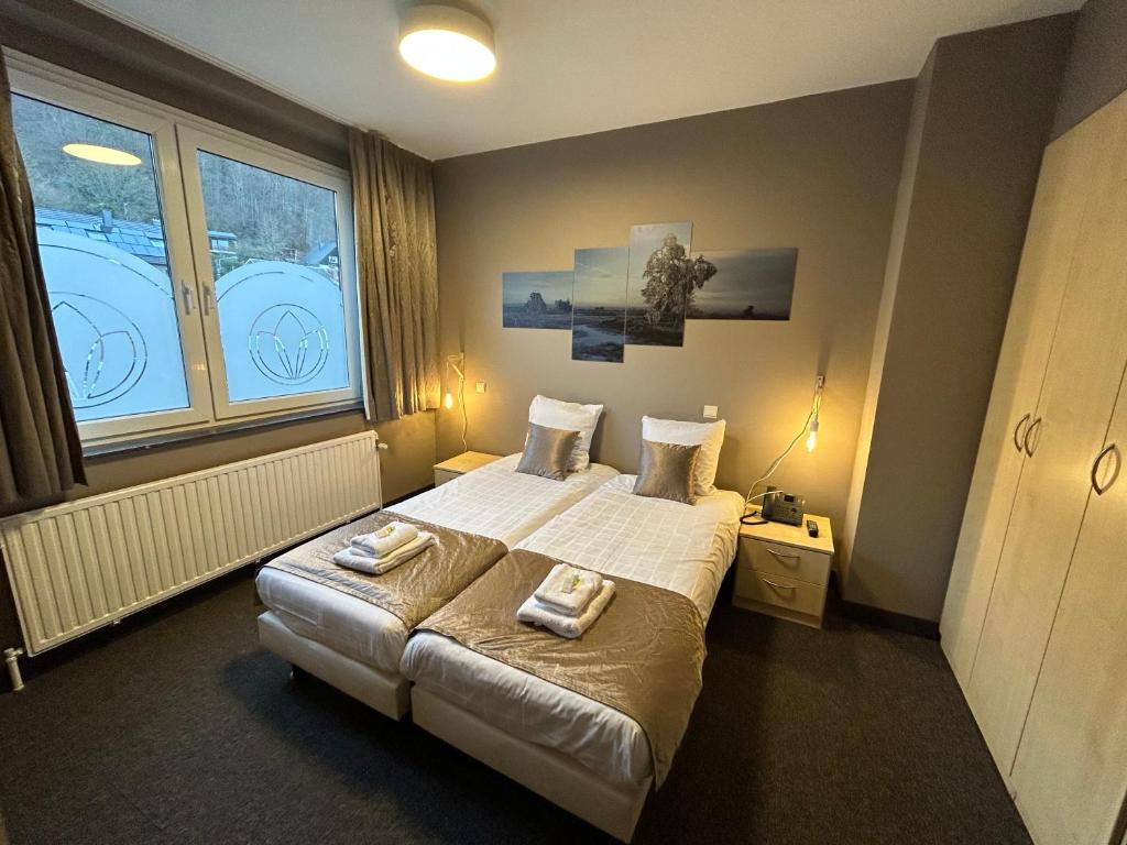 Postel nebo postele na pokoji v ubytování Floréal