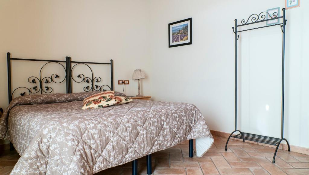 Postel nebo postele na pokoji v ubytování Agriturismo Le Tese