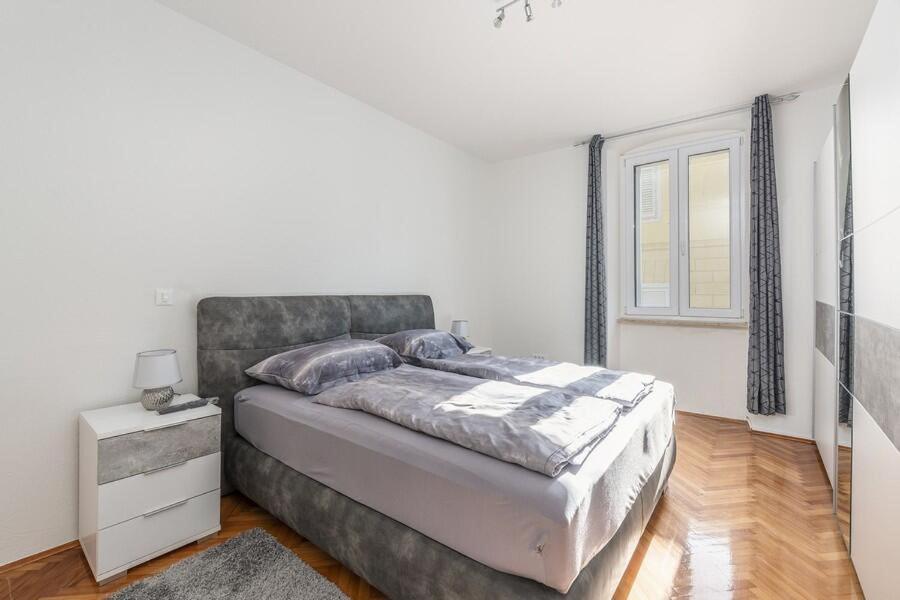 Postel nebo postele na pokoji v ubytování Penthouse Lorena