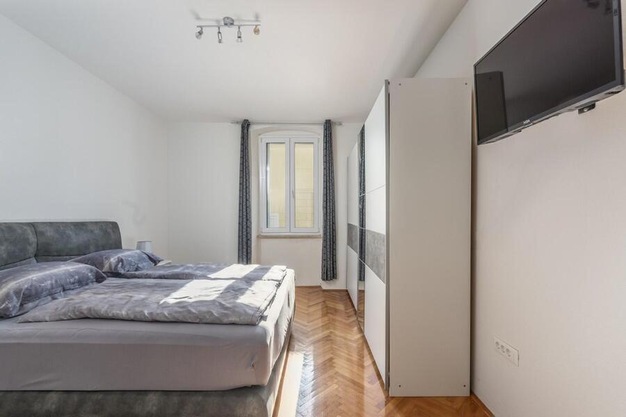 Postel nebo postele na pokoji v ubytování Penthouse Lorena