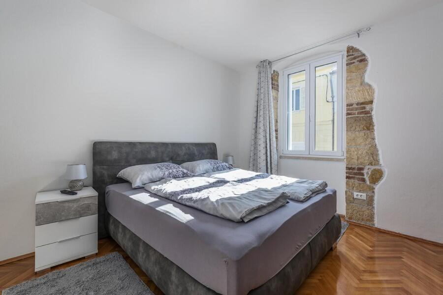 Postel nebo postele na pokoji v ubytování Penthouse Lorena