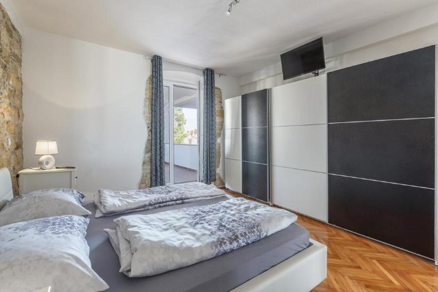 Postel nebo postele na pokoji v ubytování Penthouse Lorena