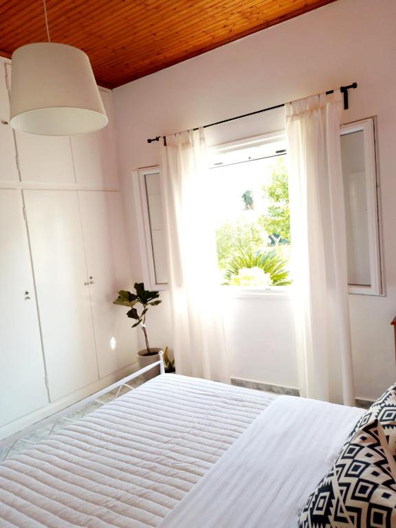 Postel nebo postele na pokoji v ubytování Manolia Apartments