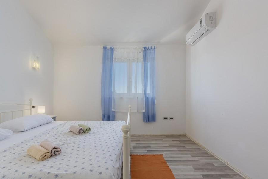 Łóżko lub łóżka w pokoju w obiekcie Holiday Home Bianca