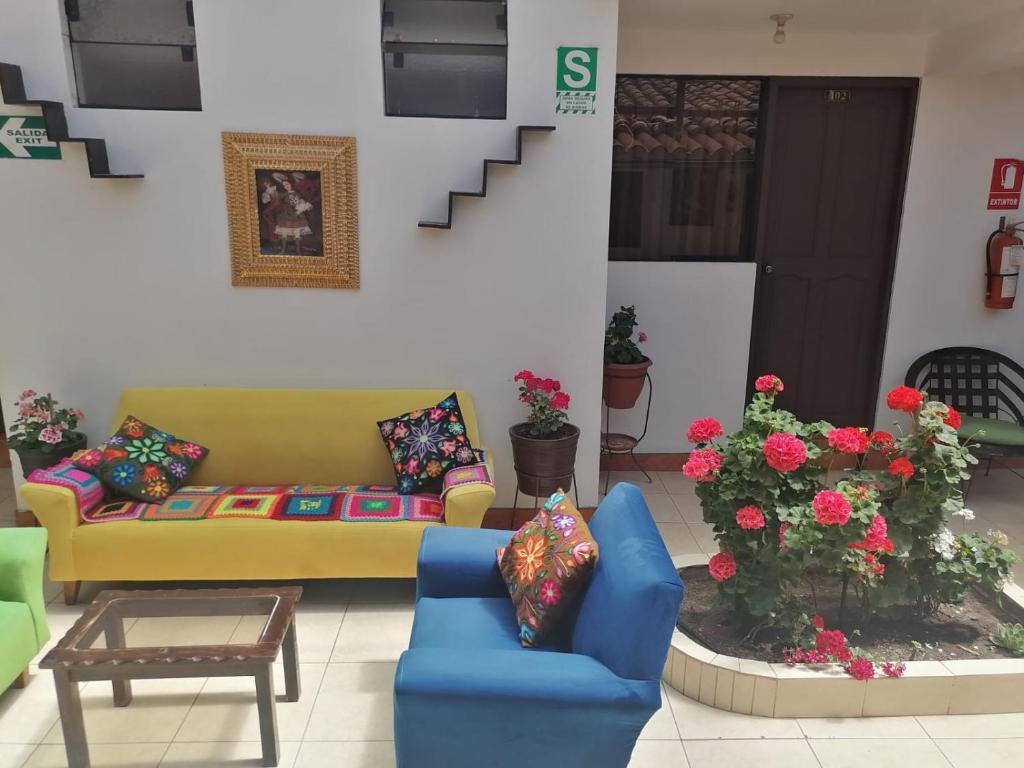a living room with a couch and a table at Suyay B&B in Cusco