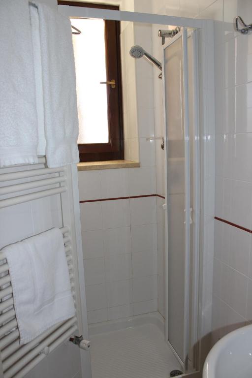 a bathroom with a shower and a sink at Masseria Valente in Ostuni