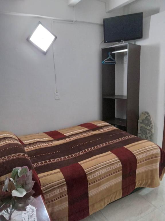Postel nebo postele na pokoji v ubytování El Hogar de Carmelita