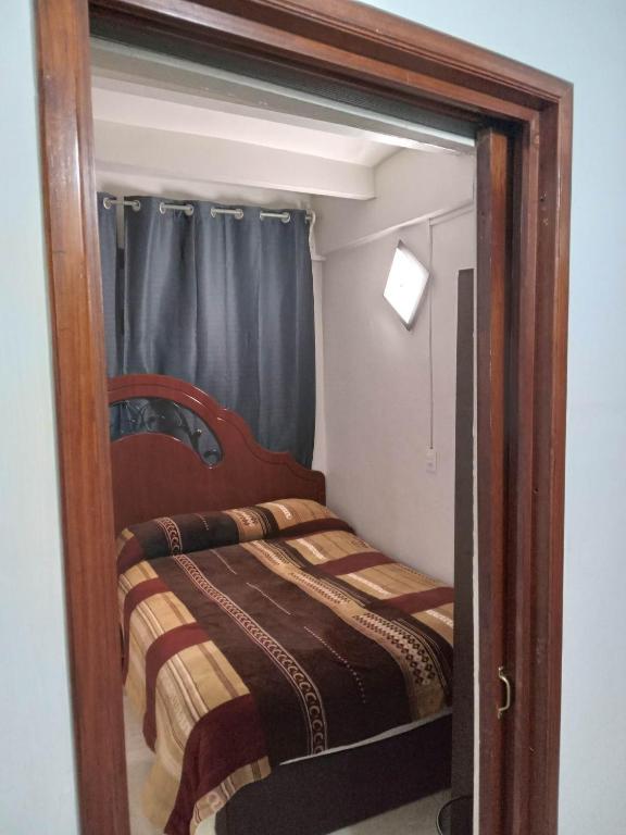 Postel nebo postele na pokoji v ubytování El Hogar de Carmelita