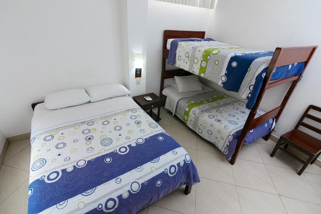 Postel nebo postele na pokoji v ubytování Hotel de Alborada
