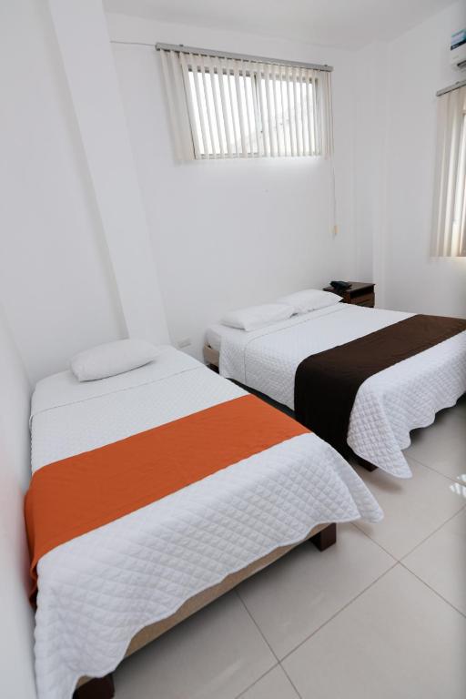 Postel nebo postele na pokoji v ubytování Hotel de Alborada