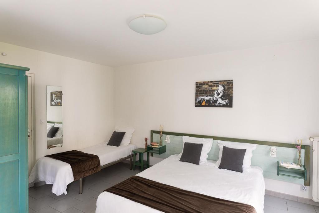 Postel nebo postele na pokoji v ubytování Appart Hotel Corte HR