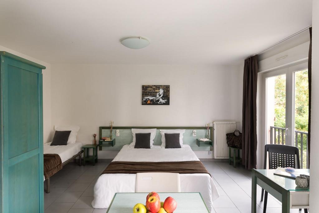 Postel nebo postele na pokoji v ubytování Appart Hotel Corte HR