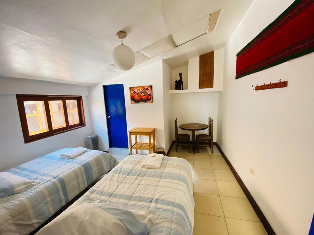 Rúm í herbergi á Flying Dog Hostel Cusco