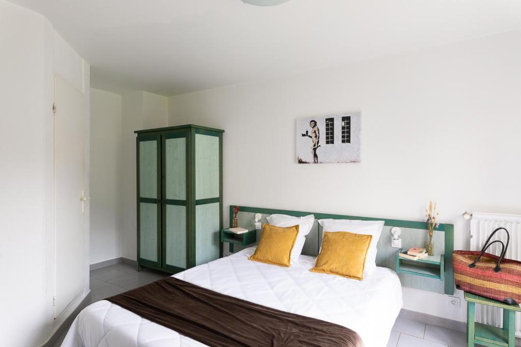 Postel nebo postele na pokoji v ubytování Appart Hotel Corte HR