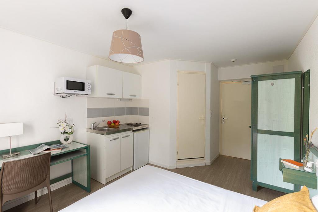 Kuchyň nebo kuchyňský kout v ubytování Appart Hotel Corte HR