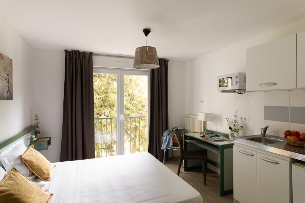 Kuchyň nebo kuchyňský kout v ubytování Appart Hotel Corte HR