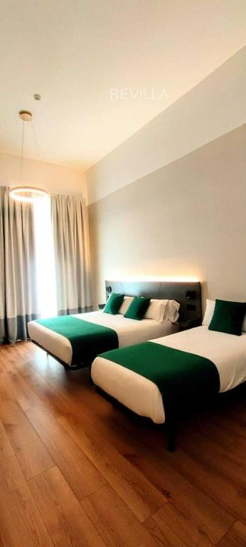 Postel nebo postele na pokoji v ubytování Hostal Anton Martin