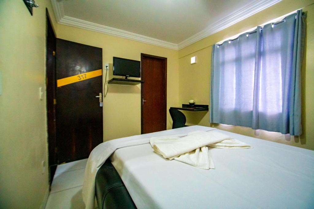 Postel nebo postele na pokoji v ubytování Hotel Pirâmide Rodoviária