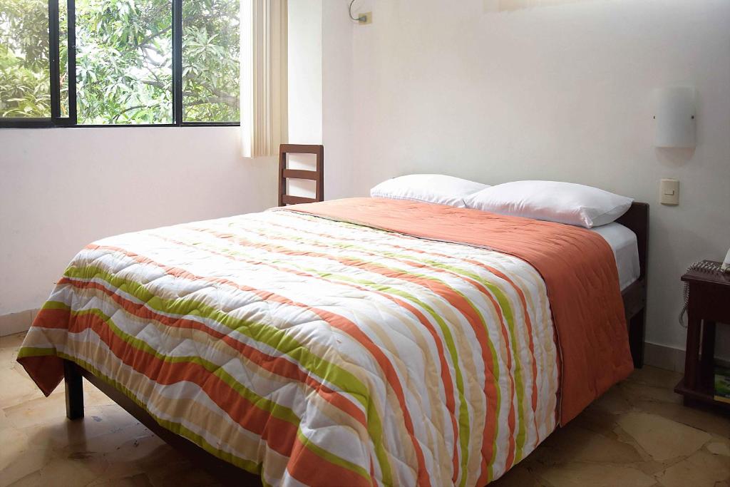 Postel nebo postele na pokoji v ubytování Hotel de Alborada