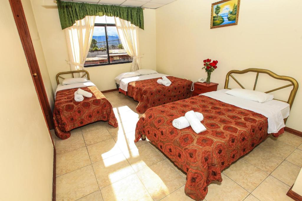Postel nebo postele na pokoji v ubytování Hotel Colonial